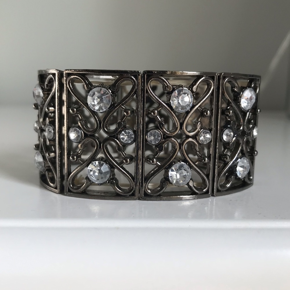 Cuff bracelet with rhinestones.